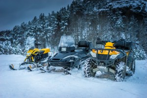 Winter Motorcycle. Snowmobile. Winter ATVs. Winter ATVs in winter against the backdrop of the mountain.