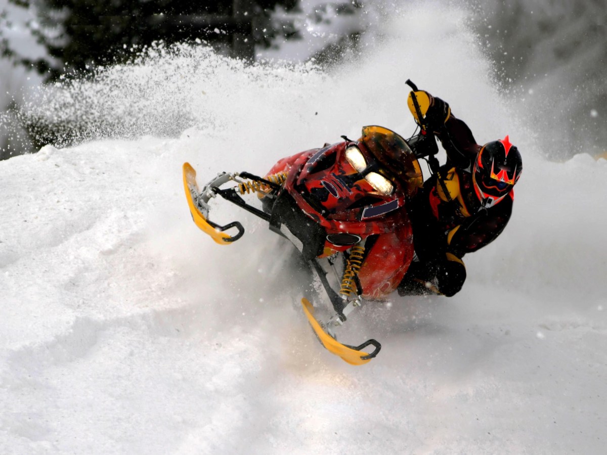 snowmobile leaning over