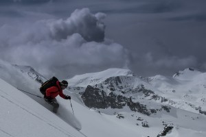 Man skiing Whistler on a grey day