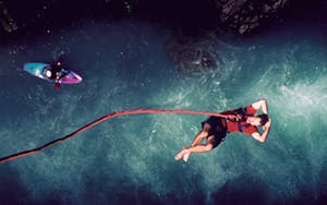 Man above water after bungee jumping in Whistler