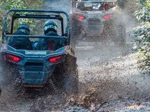 Rzr tour in Whistler through a mud puddle.