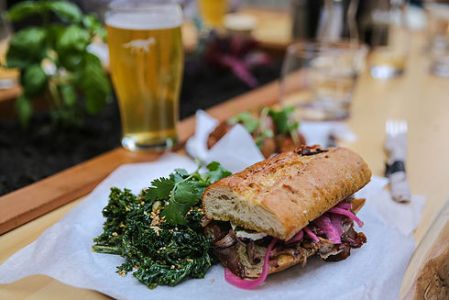 Hunter Gather in Whistler, sandwich on a Bagette with a beer.