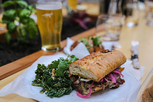 Hunter Gather in Whistler, sandwich on a Bagette with a beer.
