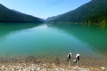 a body of water with a mountain in the background, cheakamus lake