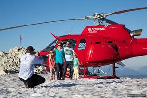 Family posing in front of Blackcomb Helicopters