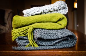 scarves stacked on a table