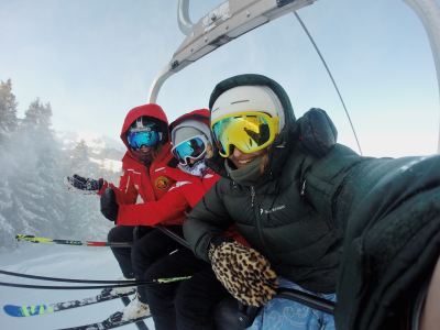 Three people on a Whistler Ski lift.