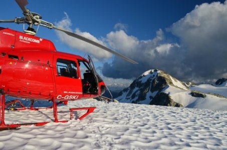 Blackcomb Helicopter, on a peak, covered in snow