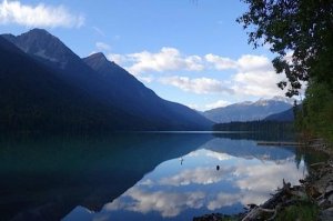 a body of water with a mountain in the background